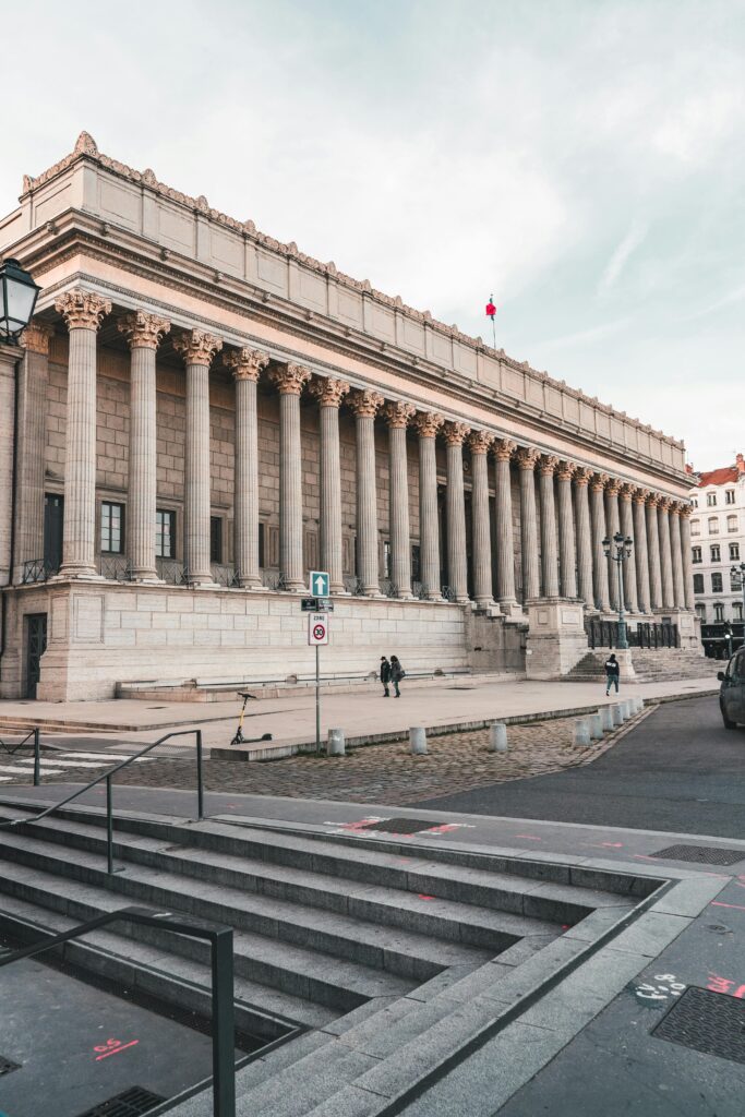 Majestic neo-classical courthouse in Lyon, France with grand columns and historic charm.