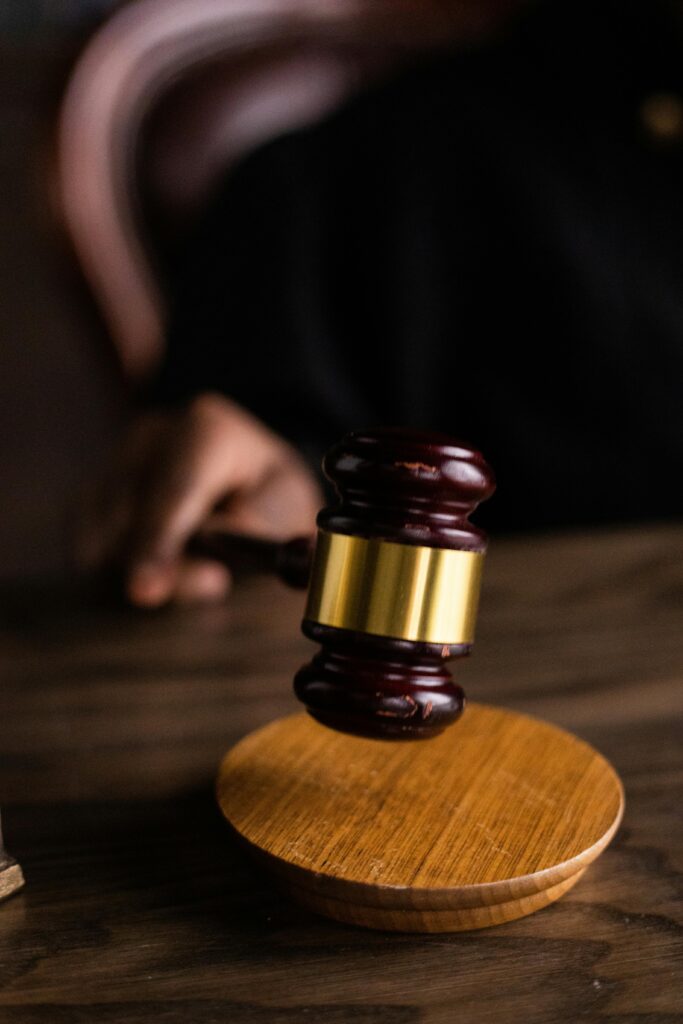pexels photo 6077189 6077189 Close-up of a judge's gavel on a wooden block, symbolizing justice and law.